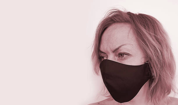 istock beautiful woman in a protective mask coronavirus 1219994494