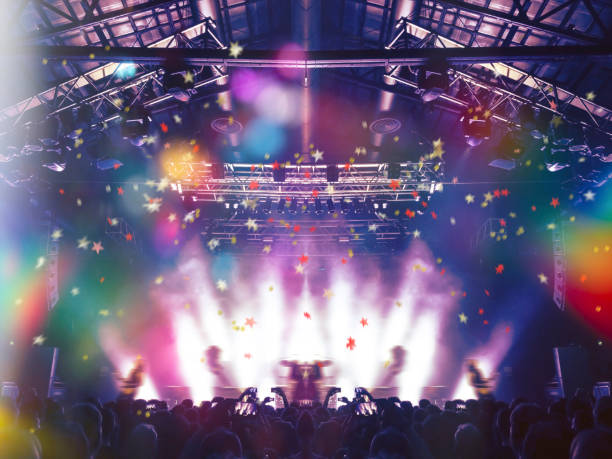 concert stage, people are visible waving and clapping, silhouettes are visible - concert hall crowd dancing nightclub imagens e fotografias de stock