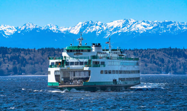 Washington State Ferry Boat Olympic Mountain Range Edmonds Washington Washington State Ferry Olympic Snow Mountains Edmonds Washington.  Ferry arriving at Ferry Port on Puget Sound. edmonds stock pictures, royalty-free photos & images