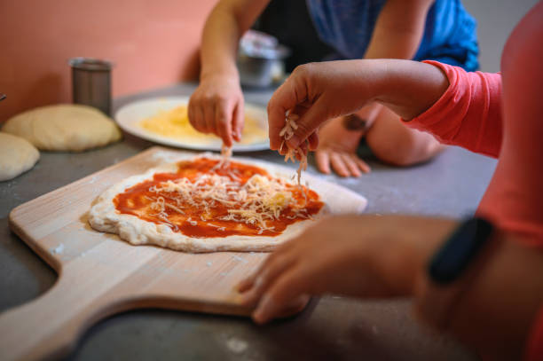 istock Mother and son preparing home made pizza 1219996020