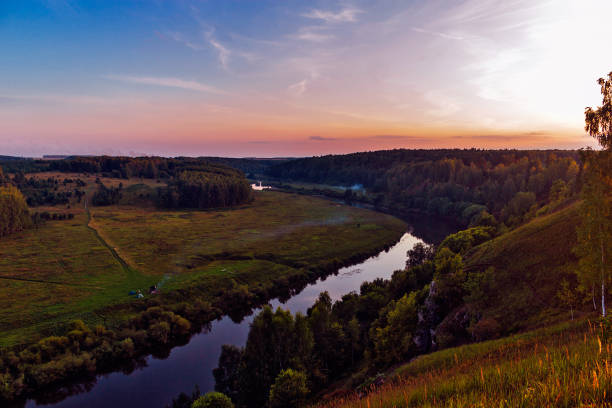 istock river and forest from a high hill at sunset 1220001247