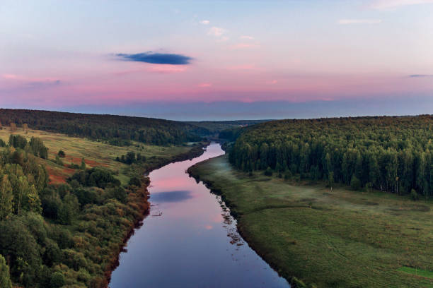 istock river and forest from a high hill at sunset 1220001248