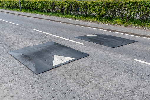 Rubber road bumps, humps in the middle of the road to reduce speed