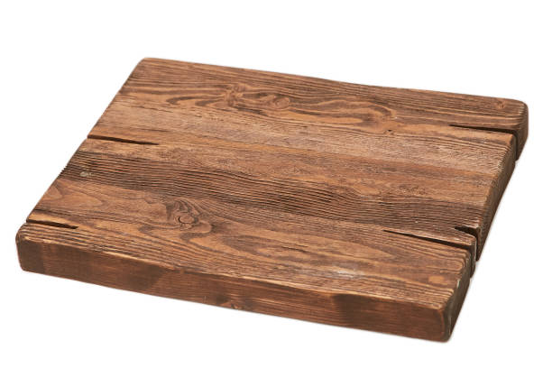 istock Cutting board made of solid dark wood. Isolated 1220001645