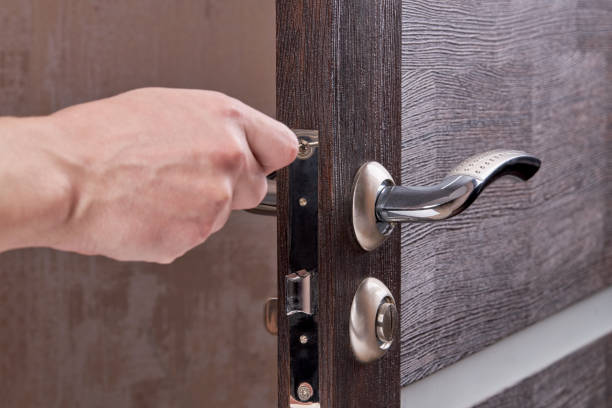 istock person fixing door furniture using screwdriver. improvement process. 1220002274
