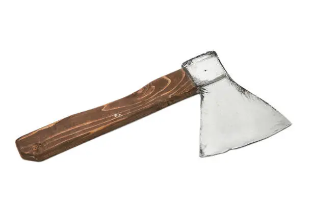 Photo of Decorative ax with a wooden handle on a white background. Isolated.