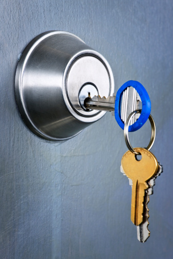 Keys inserted in door lock close up