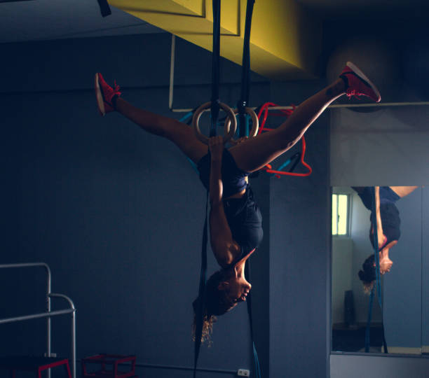 istock Woman working out with rhythmic gymnastic rings in a gym 1220006246