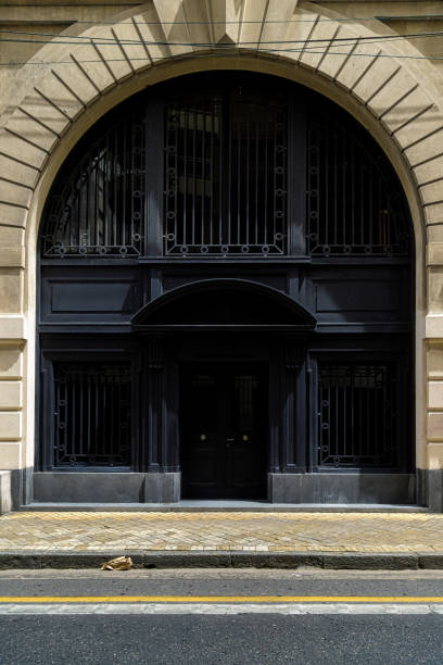 istock Black iron entrance door in a classic style building 1220006340