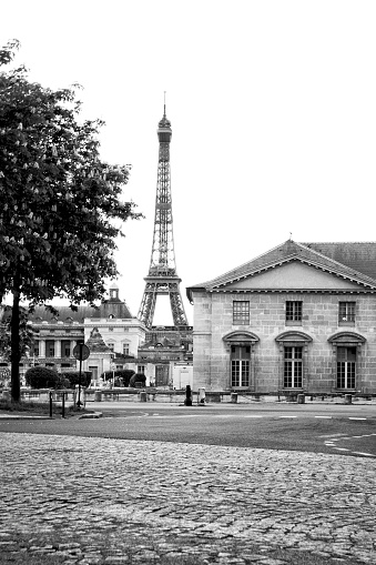 A black and white photo of the Eiffel Tower and part of Paris