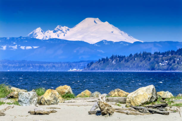 Mount Baker Bracketts Landing North Beach Park Edmonds Washington Mount Baker Mukilteo Snow Mountain Bracketts Landing North Beach Park Edmonds Washington.  Park is next to Ferry Port.  Mukilteo another Ferry Port in the distance. edmonds stock pictures, royalty-free photos & images