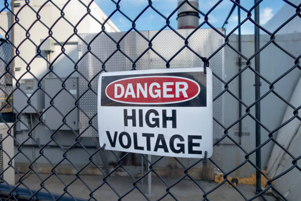 istock Danger high voltage sign on a fence 1220016200