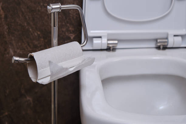 istock Leftover paper next to the white toilet bowl, close-up. Coronavirus quarantine and isolation in the event of an flu epidemic 1220016607