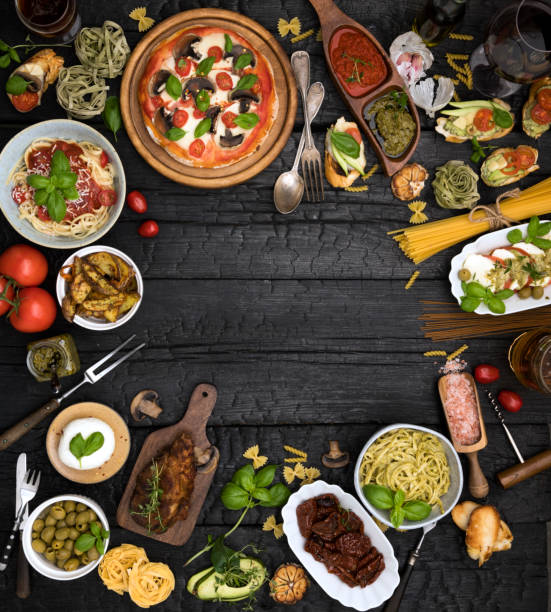 istock Different food cooked on a dark wooden background 1220017733
