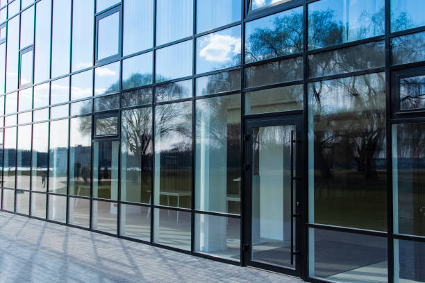 istock modern glass windows office building architecture facade building outside urban view walking space in city 1220019791
