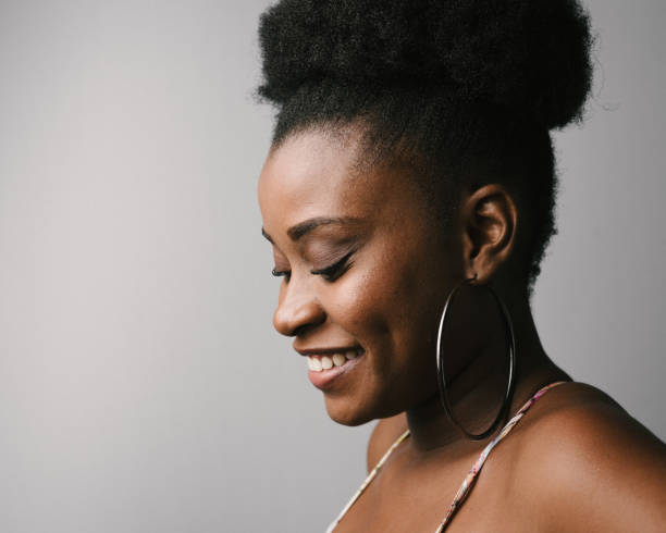 istock Woman looking down and smiling 1220020606