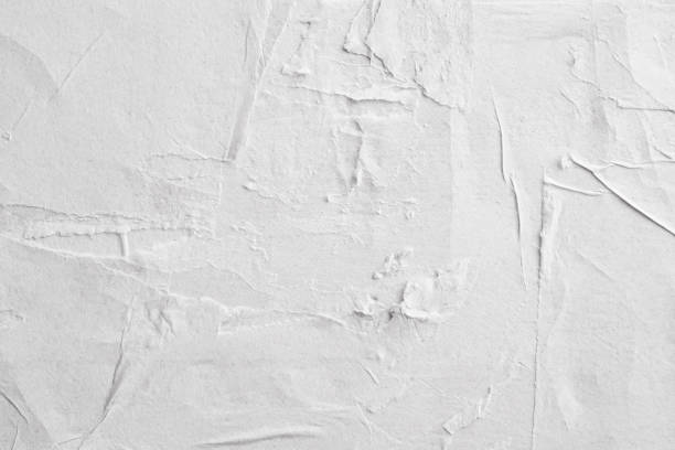 istock Blank white crumpled and creased paper poster texture background 1220021390