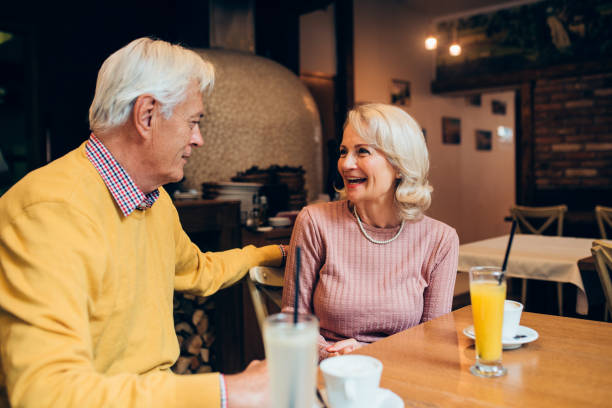istock Mature couple enjoying together at the cafe 1220021457