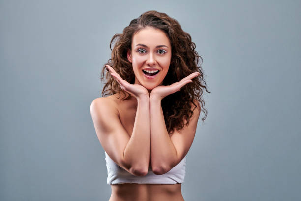 istock Surprised happy beautiful woman looking in camera. 1220021595
