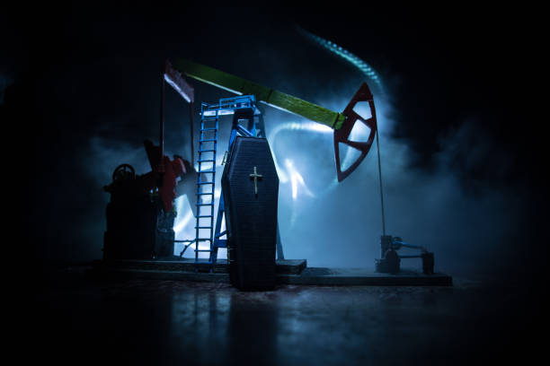 istock Stock market declining chart and oil pump jack - abstract background 1220023124