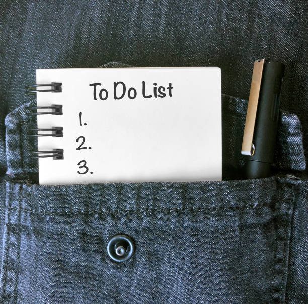istock To do list, notebook and pencil in shirt pocket. 1220029500