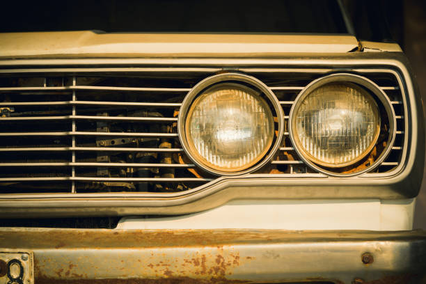 istock Close up headlight lamp of old classic car. 1220029566