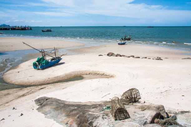 istock Boats and fish traps on the beach 1220032299