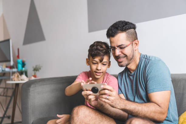 istock Father and son surfing on the internet 1220034493