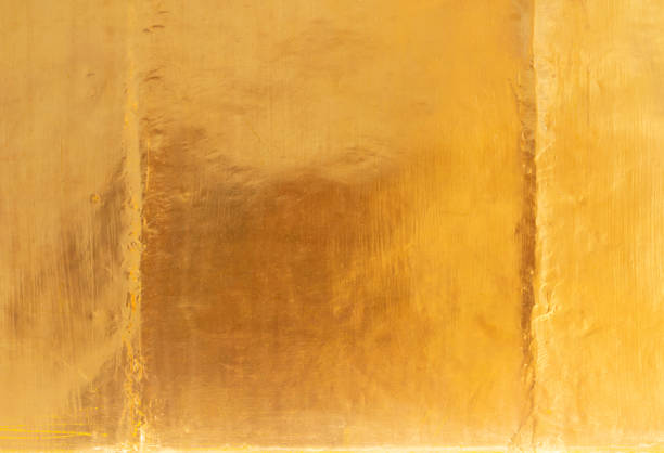 istock Shiny yellow leaf gold foil texture background 1220034656
