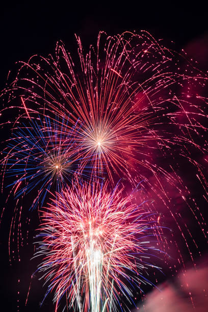 istock Image full of red white and blue fireworks bursting in the air 1220035421