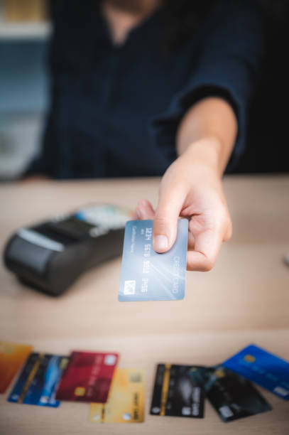 istock Hands holding credit card and using laptop. Online shopping 1220039345