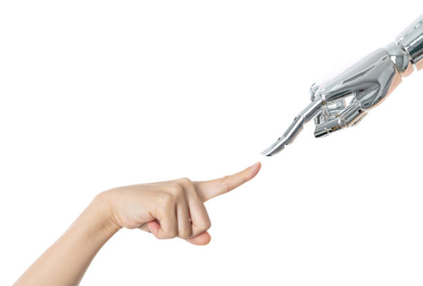 istock Human finger touching robot finger on white background 1220044695