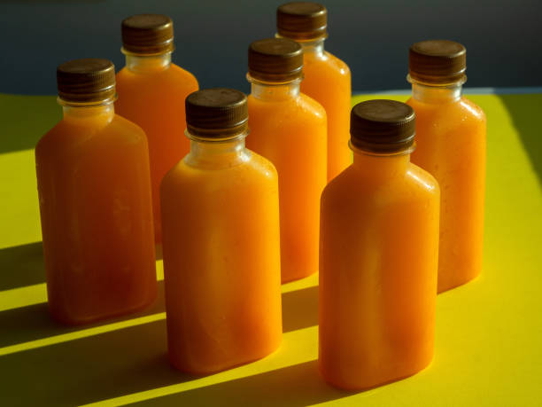 istock Orange juice iced cold in the bottles. 1220045472