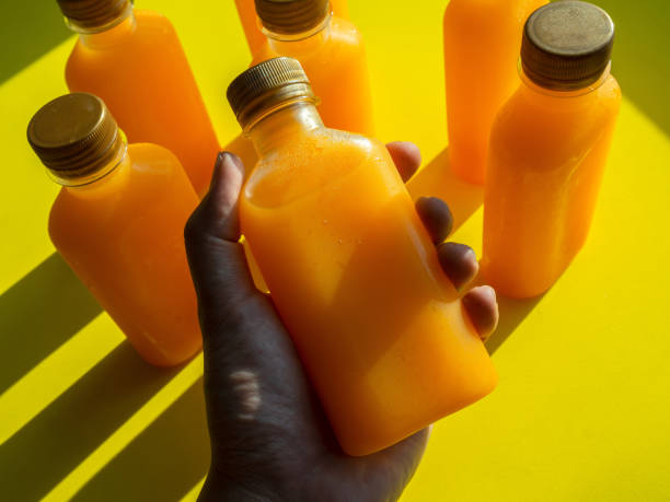 istock Orange juice iced cold in the bottles. 1220045511