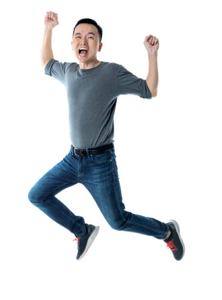 istock Excited man jumping on white background 1220045640