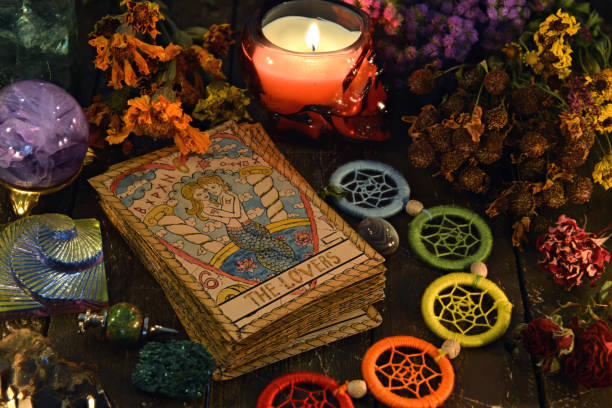 istock Tarot cards with chakra decorations, herbs and burning candle. 1220045782