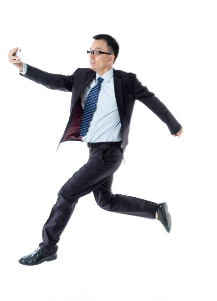 istock Businessman taking a selfie on white background 1220045803