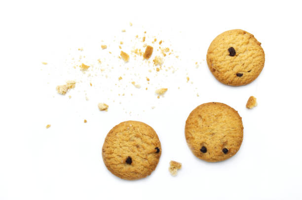 istock Chocolate chip cookies and crumble cracks on white background. Sweet biscuits delicious and crunchy homemade pastry. 1220051418