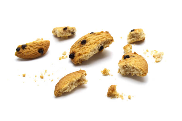 istock Chocolate chip cookies and crumble cracks isolated on white background. Sweet biscuits delicious and crunchy homemade pastry. 1220051422