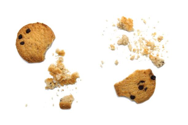 istock Chocolate chip cookies and crumble cracks on white background. Sweet biscuits delicious and crunchy homemade pastry. 1220051437