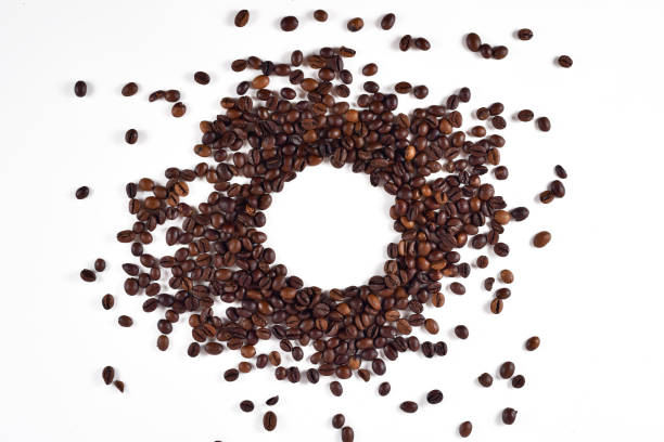 istock Roasted coffee beans, isolated on white stock photo 1220053409