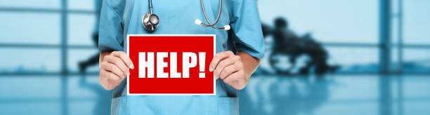 Medical doctor or nurse showing help sign on blue hospital banner background. COVID-19 outbreak emergency workers. Coronavirus doctor holding board panoramic corona virus text title Medical doctor or nurse showing help sign on blue hospital banner background. COVID-19 outbreak emergency workers. Coronavirus doctor holding board panoramic corona virus text title. sold out photos stock pictures, royalty-free photos & images