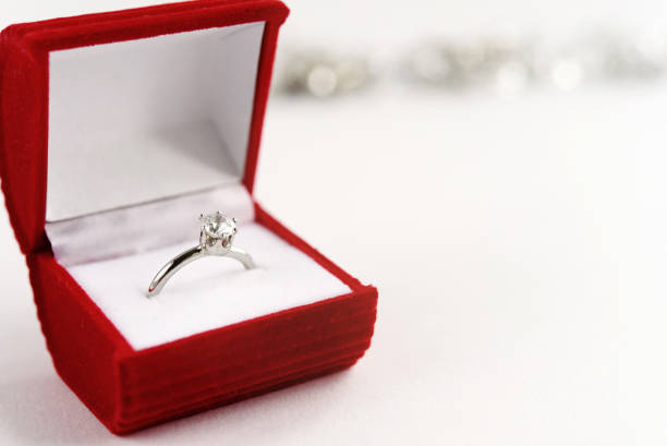 istock stylish luxury ring with diamond in red box on white background, present and love concept, valentine's day 1220056441