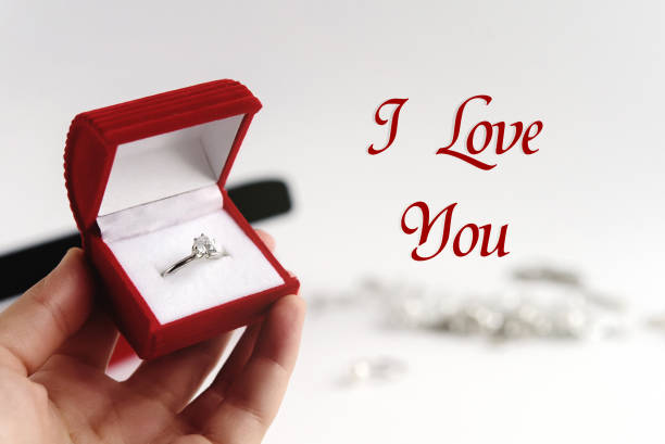 istock luxury ring in hand, i love you text, greeting card concept 1220056561
