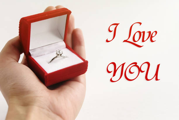 istock luxury ring in hand, i love you text, greeting card concept 1220056569