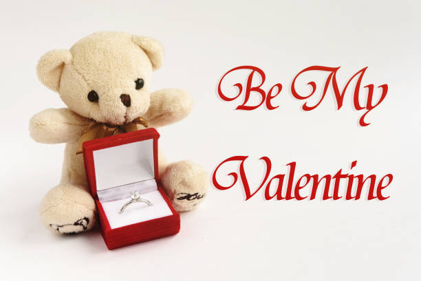istock stylish luxury ring  and teddy bear,be my valentine text, greeting card concept 1220056574