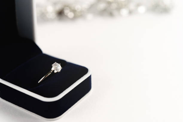 istock stylish luxury ring with diamond in blue box on white background, present and love concept, valentine's day 1220056648