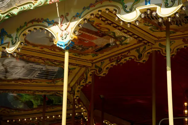 Photo of Details of a traditional Venetian carousel at the funfair.Carousel, traditional fairground ride.