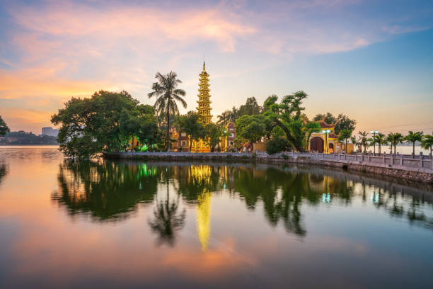 Panorama scene of Tran Quoc pagoda, the oldest temple in Hanoi, Vietnam, with brilliant sunset Panorama scene of Tran Quoc pagoda, the oldest temple in Hanoi, Vietnam, with brilliant sunset high temple stock pictures, royalty-free photos & images