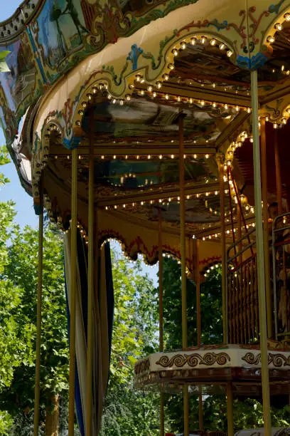 Photo of Details of a traditional Venetian carousel at the funfair.Carousel, traditional fairground ride.